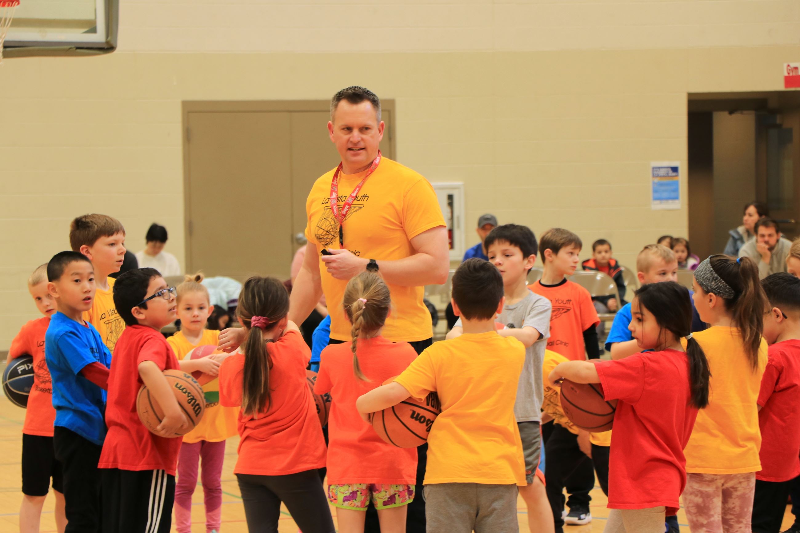 Children holding basketballs
